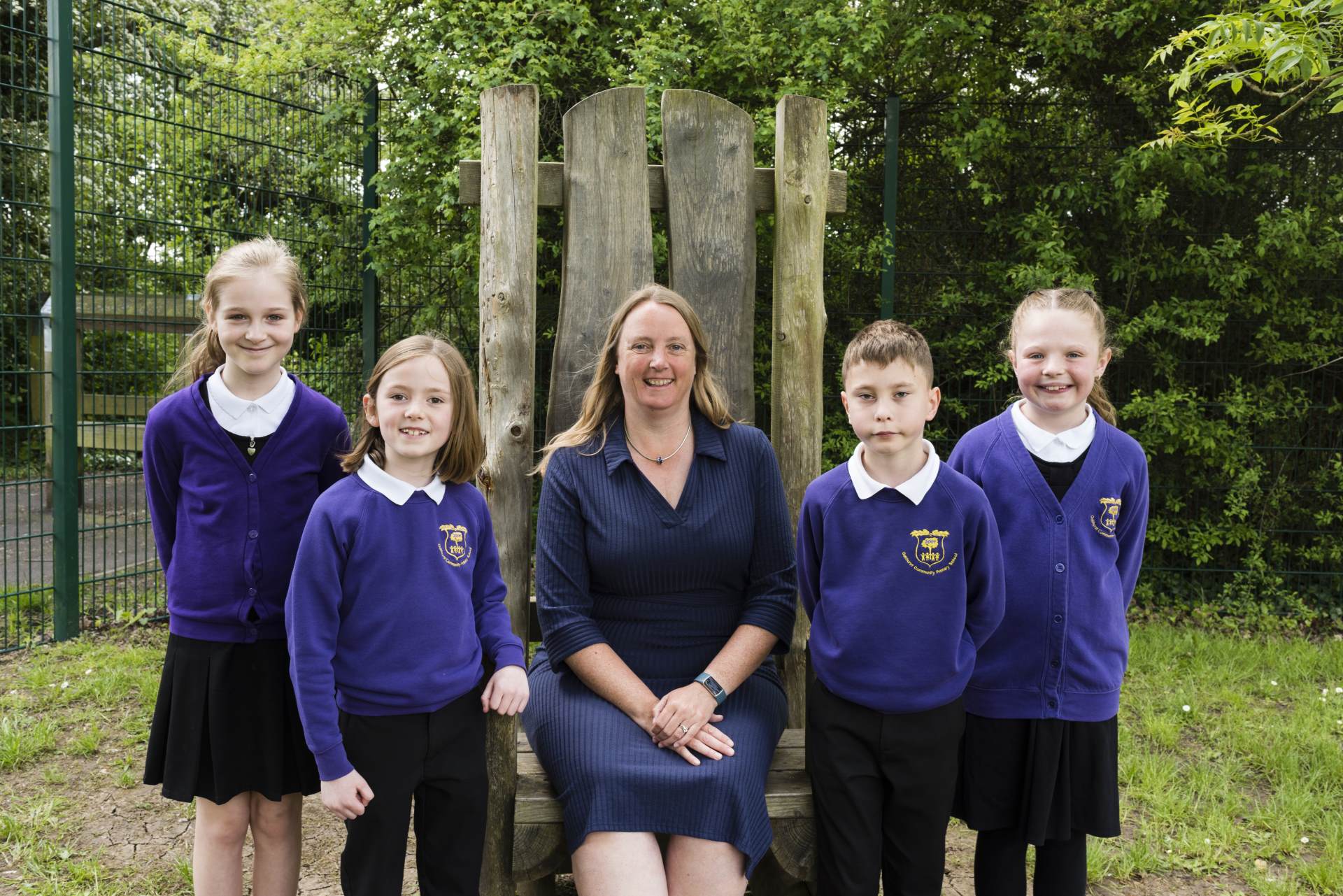 Headteacher with pupils from Oakhurst Community Primary School